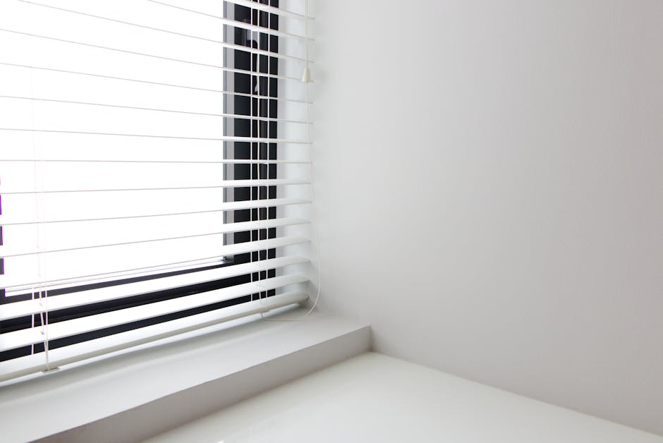 Clean white custom vinyl window frame installed in a modern home