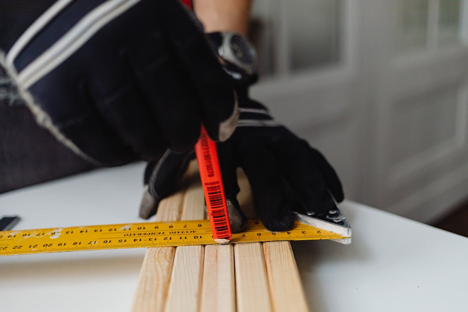 Experienced carpenter measuring a window frame for precise installation